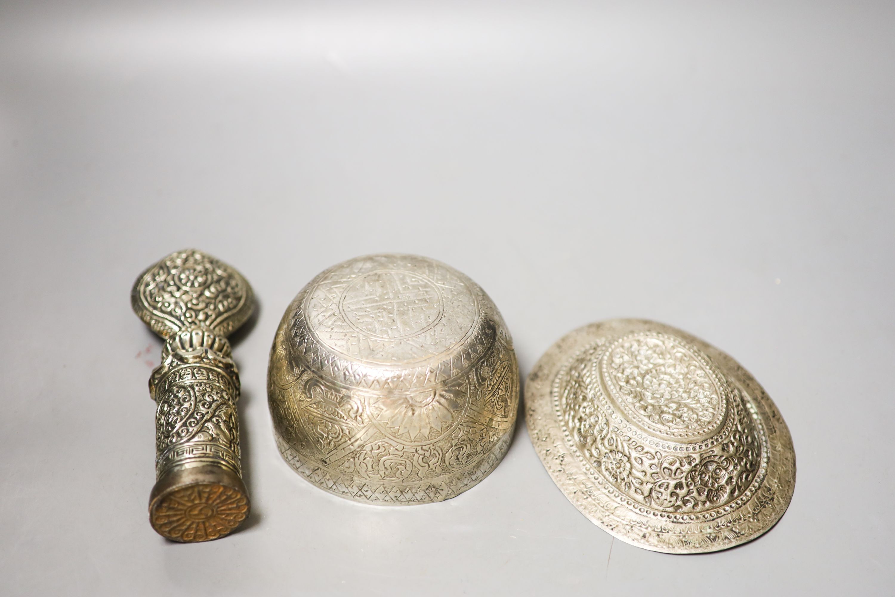 Two Tibetan white metal bowls, similar seal stamp 19cm